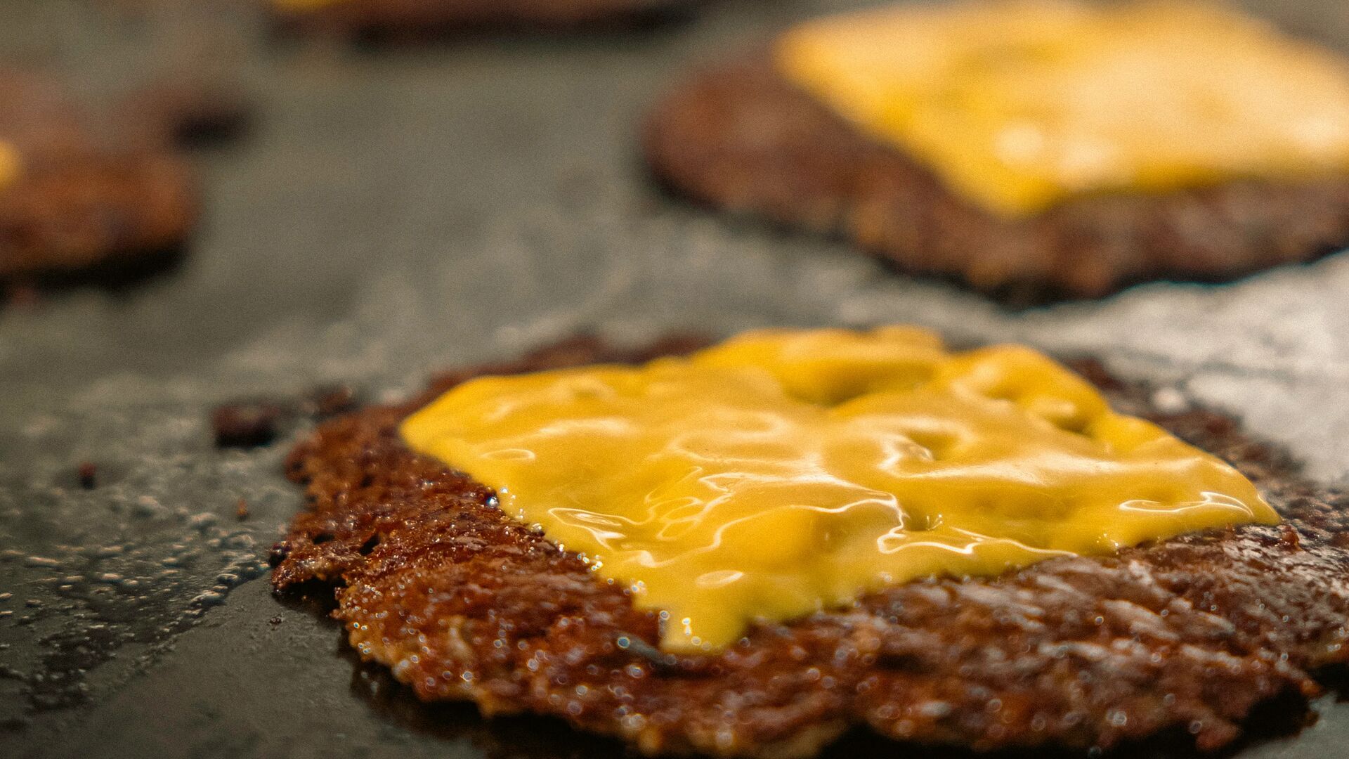 Smash burgers cooking